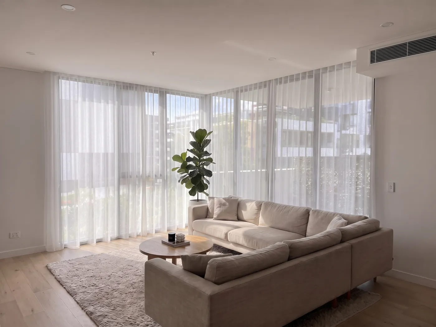 After — Bare glass to a full wall of sheers, curtains by Crown Curtain and Blind