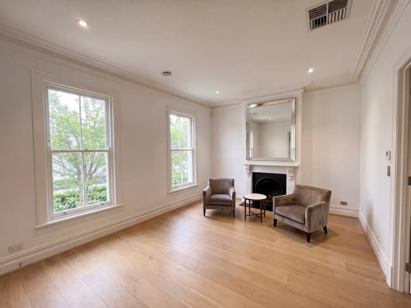 Before — the same room with bare windows