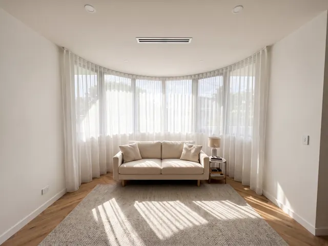Sheers on a curved bay window — Track shaped to follow the bay